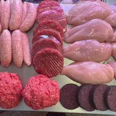 selection of meat on steel counter